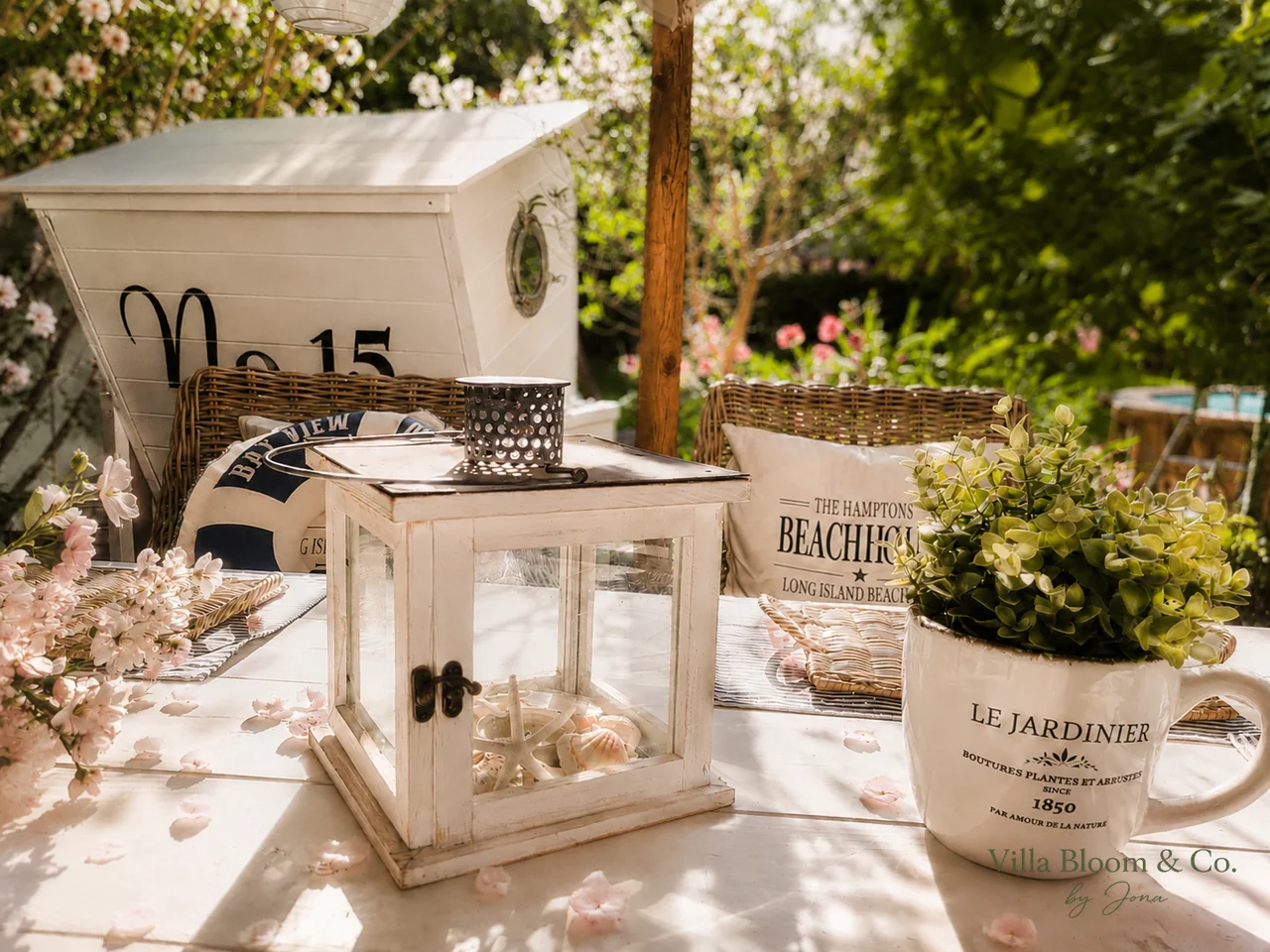 Summery still life with beach-house cushion, Le Jardinier mug and lantern